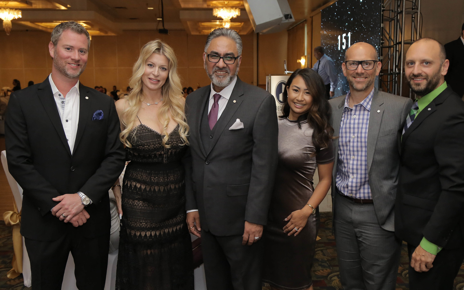 Perminder Chohan with guests at a gala