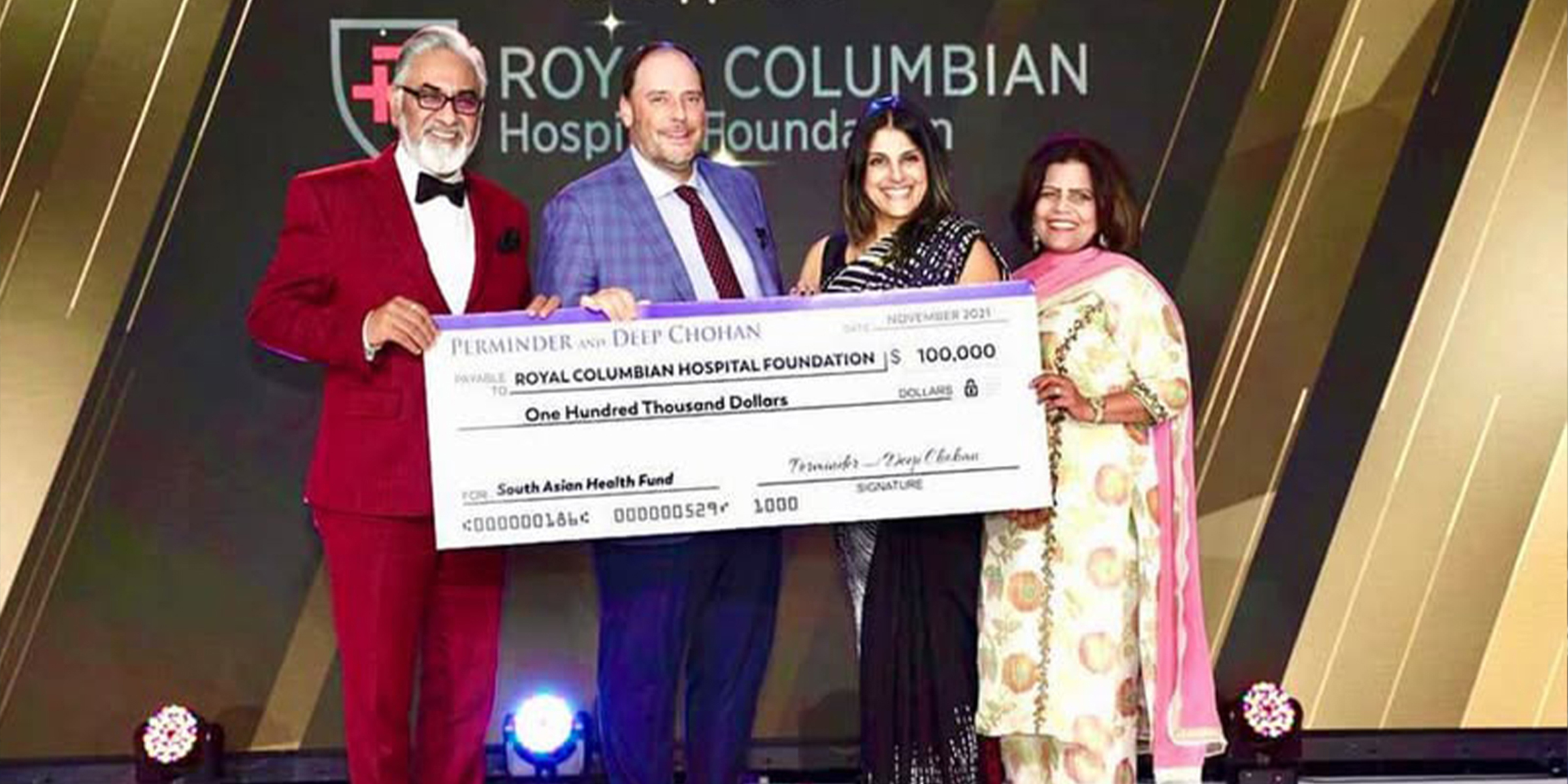 Perminder and Deep Chohan presenting a cheque to the Royal Columbian Hospital Foundation