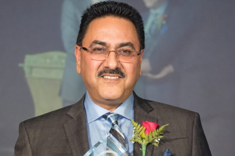 Perminder Chohan receiving an award