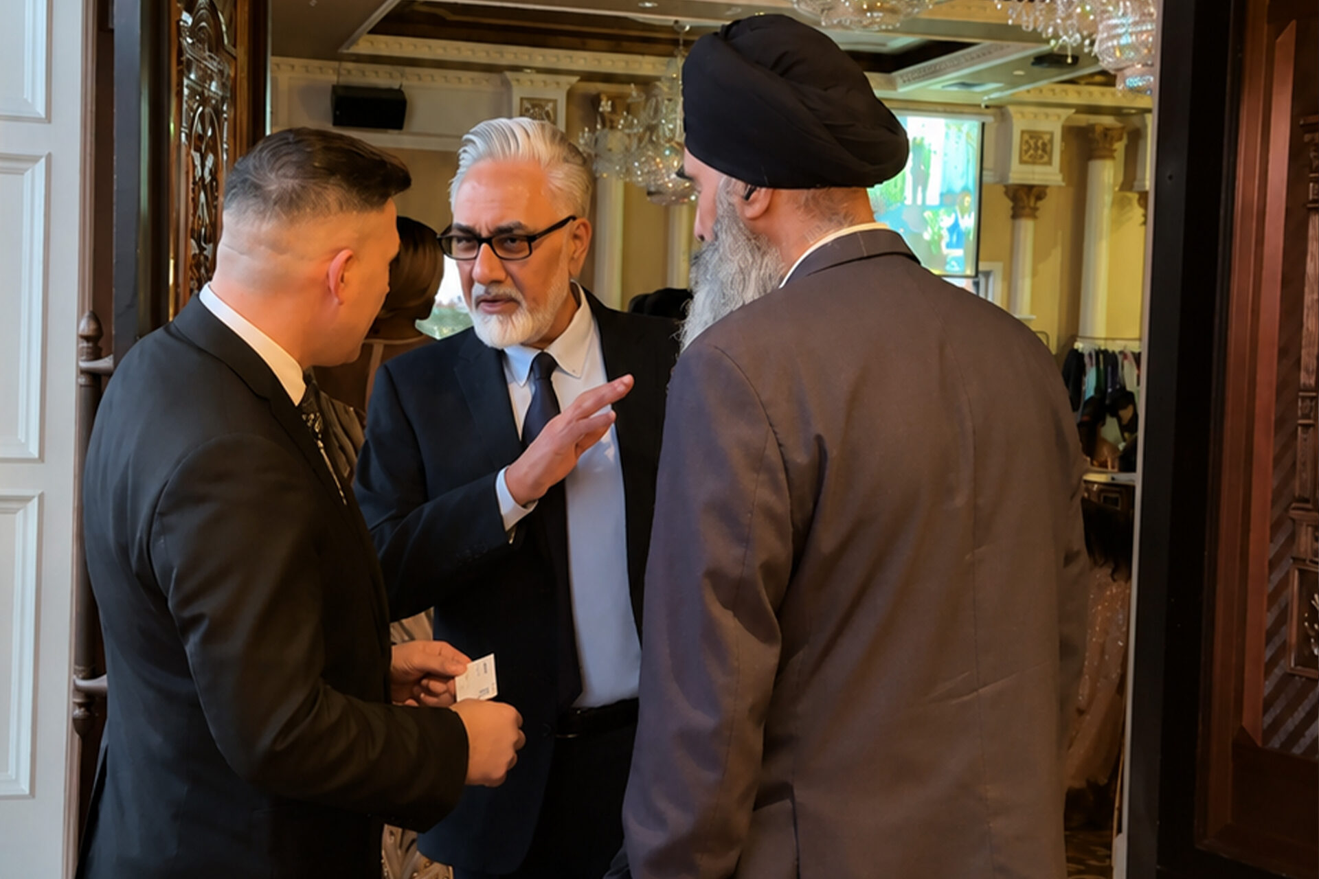 Perminder Chohan greeting guests at a community event