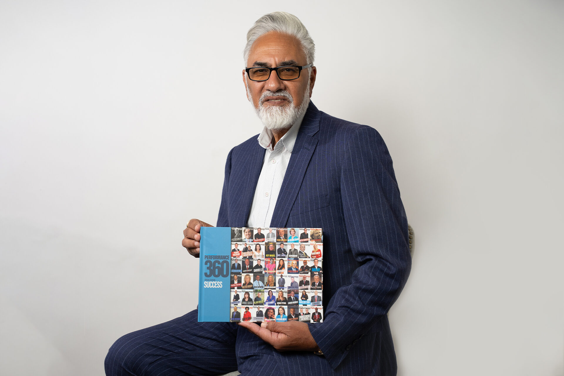 Perminder Chohan holding Performance 360 Success